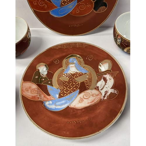 275 - A VINTAGE JAPANESE PARTIAL TEA SERVICE, to include four teacups and saucers, all with painted figura... 