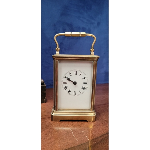 288 - A GOOD QUALITY BRASS CARRIAGE CLOCK, with bevelled glass panes on all sides including the top. The d... 