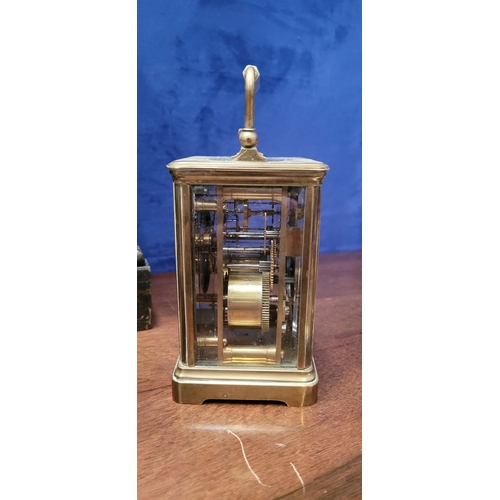 288 - A GOOD QUALITY BRASS CARRIAGE CLOCK, with bevelled glass panes on all sides including the top. The d... 