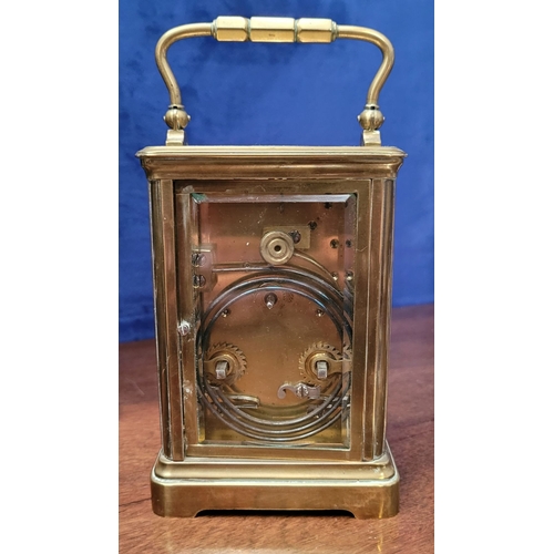 288 - A GOOD QUALITY BRASS CARRIAGE CLOCK, with bevelled glass panes on all sides including the top. The d... 