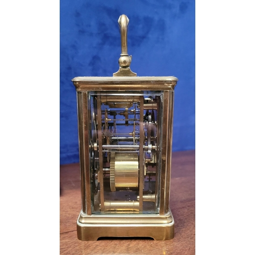 288 - A GOOD QUALITY BRASS CARRIAGE CLOCK, with bevelled glass panes on all sides including the top. The d... 