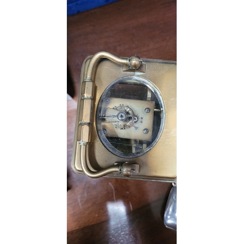 288 - A GOOD QUALITY BRASS CARRIAGE CLOCK, with bevelled glass panes on all sides including the top. The d... 