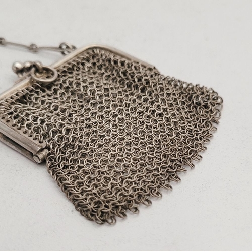 291 - TWO EARLY 20TH CENTURY DELICATELY MADE SILVER MESH PURSES, (i) A small silver mesh sovereign purse, ... 