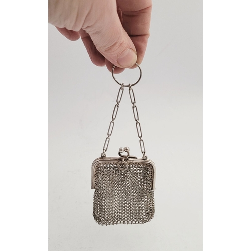 291 - TWO EARLY 20TH CENTURY DELICATELY MADE SILVER MESH PURSES, (i) A small silver mesh sovereign purse, ... 