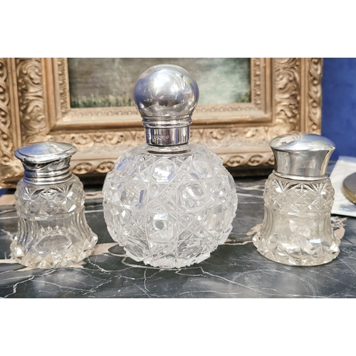 292 - A TRIO OF LATE 19TH CENTURY SILVER TOPPED CUT GLASS DRESSING TABLE CONTAINERS, (i) A rounded cut gla... 