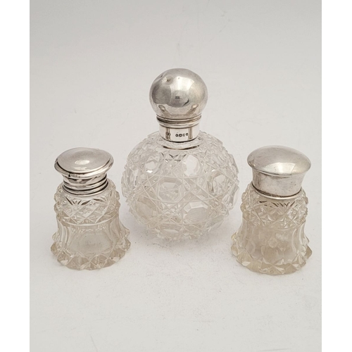 292 - A TRIO OF LATE 19TH CENTURY SILVER TOPPED CUT GLASS DRESSING TABLE CONTAINERS, (i) A rounded cut gla... 