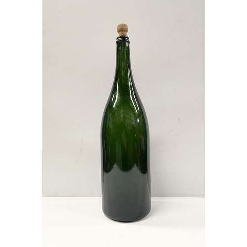 299 - A LARGE VINTAGE GREEN GLASS CHAMPAGNE BOTTLE, S.G. Jeroboam bottle, marked to base, dimensions: 48cm... 