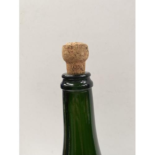 299 - A LARGE VINTAGE GREEN GLASS CHAMPAGNE BOTTLE, S.G. Jeroboam bottle, marked to base, dimensions: 48cm... 