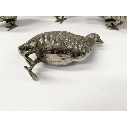 300 - A COLLECTION OF FIVE WHITE METAL QUAILS/GAME BIRDS, possibly silver plated, no visible marked, nicel... 