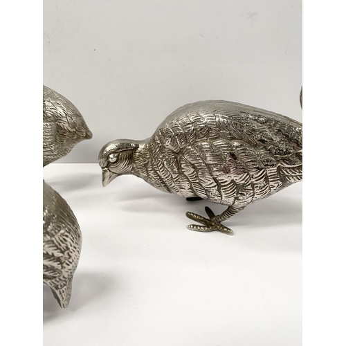 300 - A COLLECTION OF FIVE WHITE METAL QUAILS/GAME BIRDS, possibly silver plated, no visible marked, nicel... 