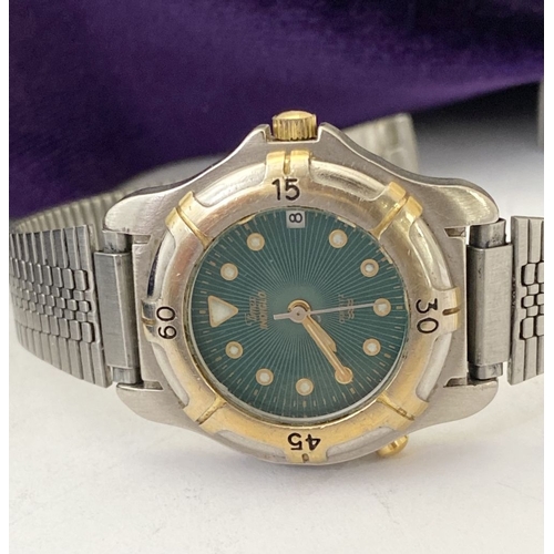 303 - A VINTAGE TIMEX INTAGLIO LADIES WRISTWATCH, quartz movement, with green dial, base metal bezel, stai... 