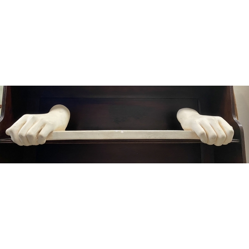 318 - A PLASTER CAST HANGING SHELF, in the form of pair of hands holding shelf, handing hooks to reverse. ... 