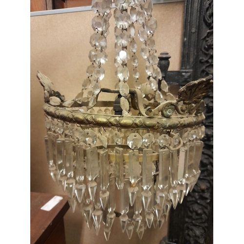 328 - AN ANTIQUE FRENCH EMPIRE STYLE CRYSTAL CHANDELIER, gilt frame with acanthus leaf design to top and s... 