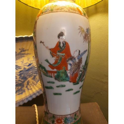 329 - A CHINESE FAMILLE ROSE PAINTED TABLE LAMP, the exterior finely decorated with painted figural pictur... 