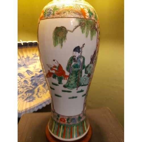 329 - A CHINESE FAMILLE ROSE PAINTED TABLE LAMP, the exterior finely decorated with painted figural pictur... 