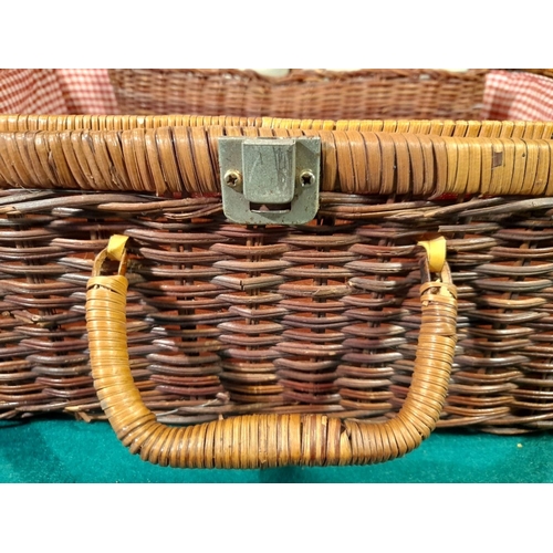 332 - AN ELEGANT VINTAGE WICKER PICNIC BASKET, with gingham lined interior, carrying handles and straps. I... 