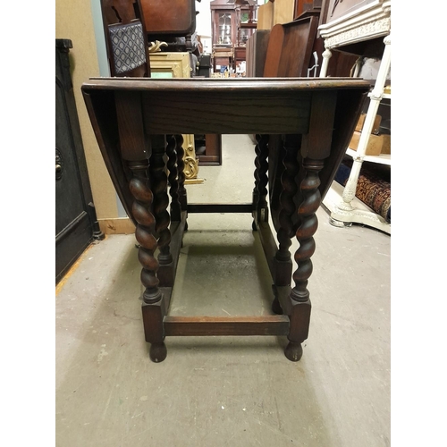 334 - AN OAK BARLEY TWIST GATE LEG SUTHERLAND TABLE, in overall good condition, with repair needed to one ... 