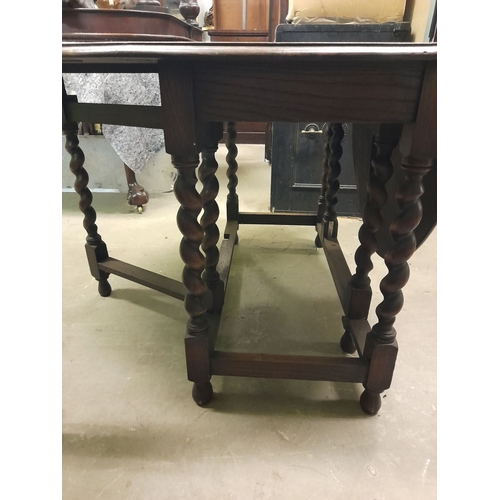 334 - AN OAK BARLEY TWIST GATE LEG SUTHERLAND TABLE, in overall good condition, with repair needed to one ... 