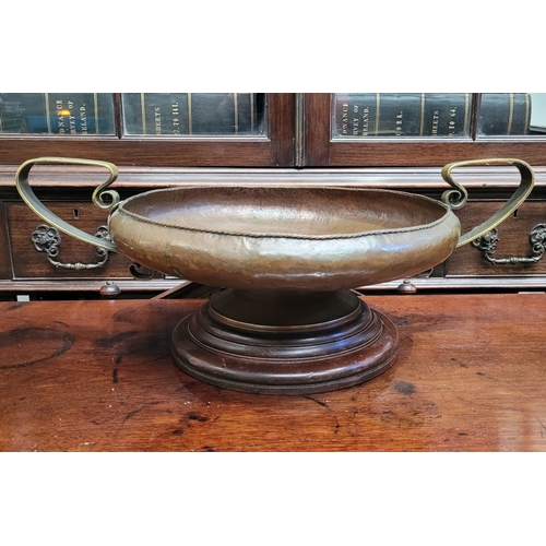 340 - A LARGE IRISH HANDMADE ARTS AND CRAFTS COPPER & BRASS CENTRE BOWL, the handles with a curved scroll ... 