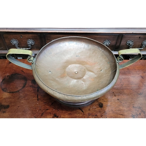 340 - A LARGE IRISH HANDMADE ARTS AND CRAFTS COPPER & BRASS CENTRE BOWL, the handles with a curved scroll ... 