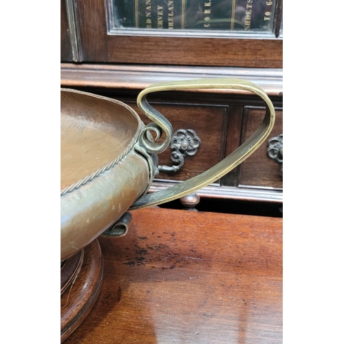 340 - A LARGE IRISH HANDMADE ARTS AND CRAFTS COPPER & BRASS CENTRE BOWL, the handles with a curved scroll ... 