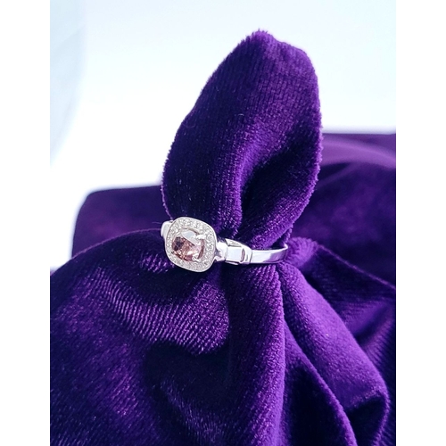 36 - A PRETTY DIAMOND CLUSTER RING – with a oval shaped natural fancy pink/brown diamond to the centre; a... 