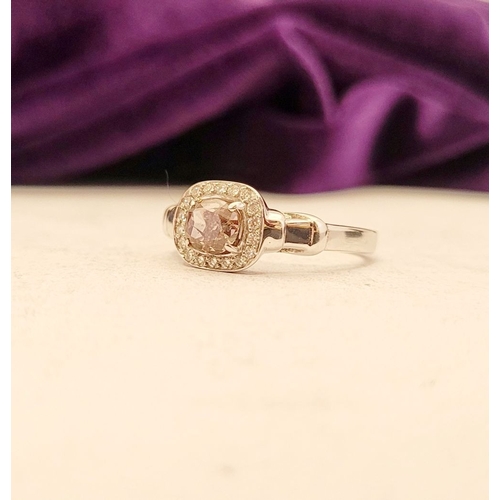 36 - A PRETTY DIAMOND CLUSTER RING – with a oval shaped natural fancy pink/brown diamond to the centre; a... 