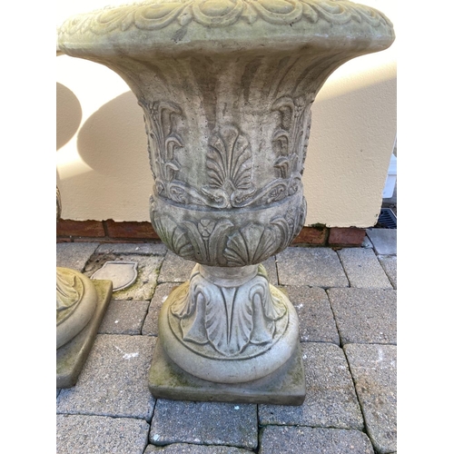 367 - AN EXCELLENT PAIR OF STONE GARDEN URNS, with acanthus leaves to body, raised on supports on square b... 