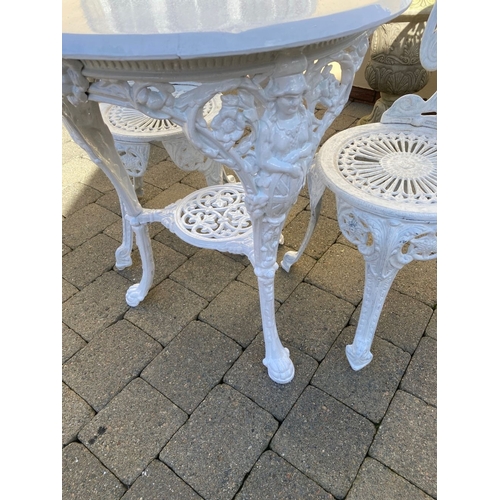 368 - A CAST IRON GARDEN TABLE WITH TWO ALLOY GARDEN CHAIRS. The chairs with nice openwork medallion backr... 