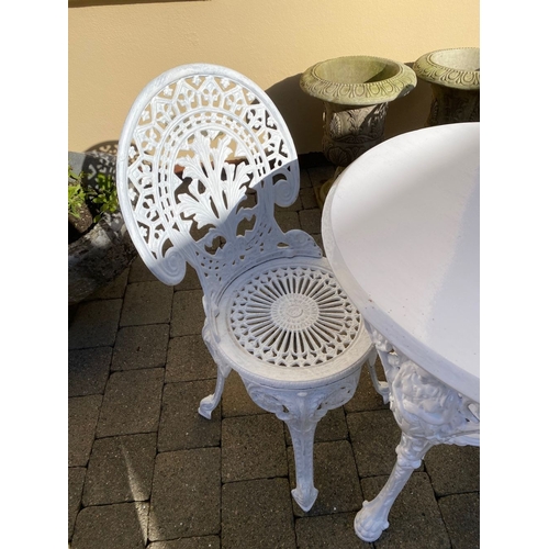 368 - A CAST IRON GARDEN TABLE WITH TWO ALLOY GARDEN CHAIRS. The chairs with nice openwork medallion backr... 