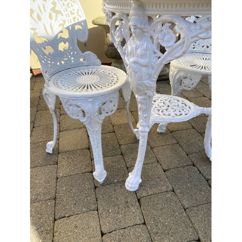 368 - A CAST IRON GARDEN TABLE WITH TWO ALLOY GARDEN CHAIRS. The chairs with nice openwork medallion backr... 