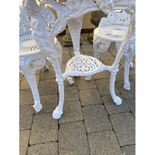 368 - A CAST IRON GARDEN TABLE WITH TWO ALLOY GARDEN CHAIRS. The chairs with nice openwork medallion backr... 