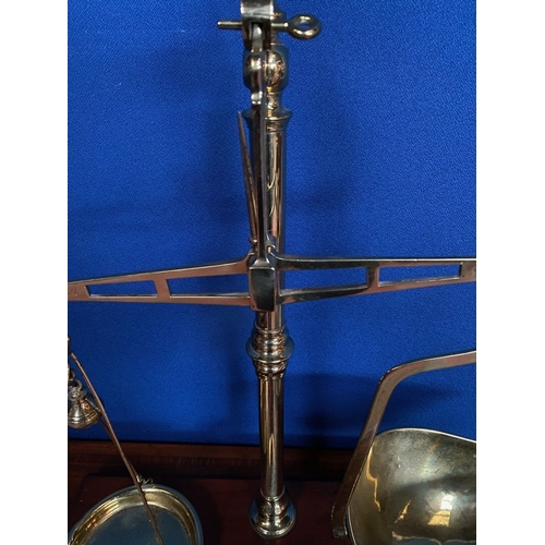 369 - AN EXCELLENT AVERY BRASS WEIGHING SCALES, Makers name to hardwood base, complete with graduating set... 