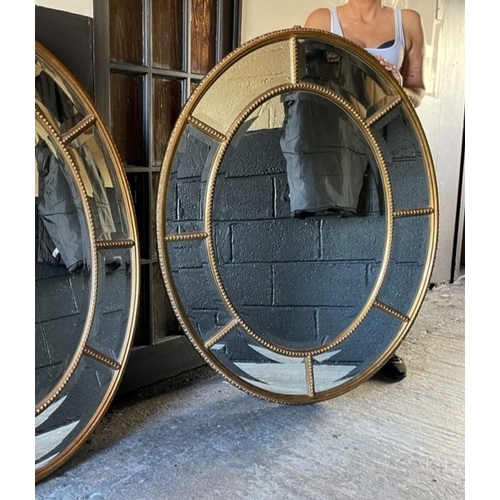 38 - A PAIR OF EXCELLENT QUALITY LARGE GILT OVER MIRRORS, each with central bevelled glass oval panel sur... 