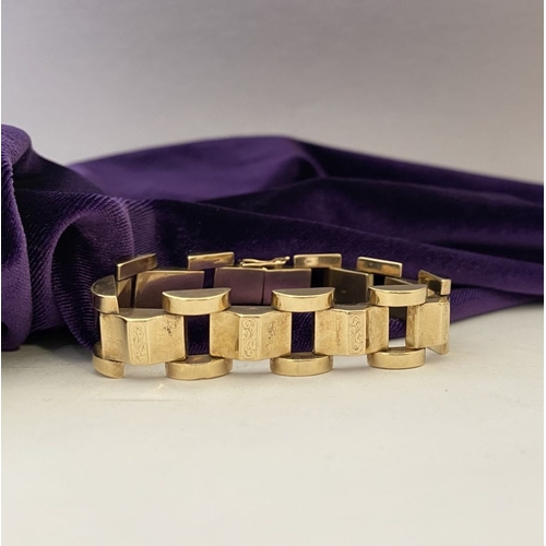 49 - A HEAVY GEORGE VI 9CT GOLD LINK BRACELET, open triple link bracelet with engraved panels to central ... 