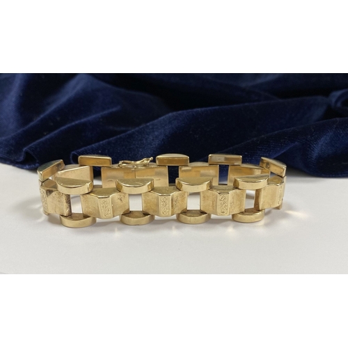 49 - A HEAVY GEORGE VI 9CT GOLD LINK BRACELET, open triple link bracelet with engraved panels to central ... 