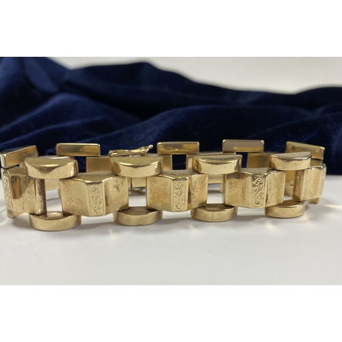 49 - A HEAVY GEORGE VI 9CT GOLD LINK BRACELET, open triple link bracelet with engraved panels to central ... 