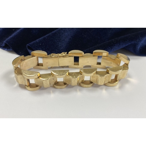 49 - A HEAVY GEORGE VI 9CT GOLD LINK BRACELET, open triple link bracelet with engraved panels to central ... 