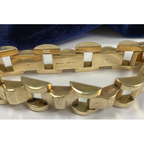 49 - A HEAVY GEORGE VI 9CT GOLD LINK BRACELET, open triple link bracelet with engraved panels to central ... 