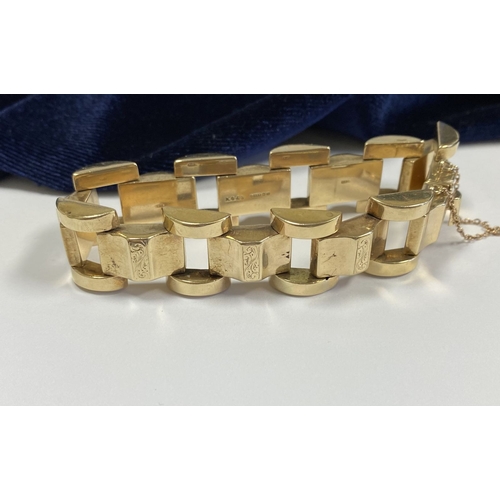 49 - A HEAVY GEORGE VI 9CT GOLD LINK BRACELET, open triple link bracelet with engraved panels to central ... 