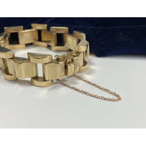 49 - A HEAVY GEORGE VI 9CT GOLD LINK BRACELET, open triple link bracelet with engraved panels to central ... 