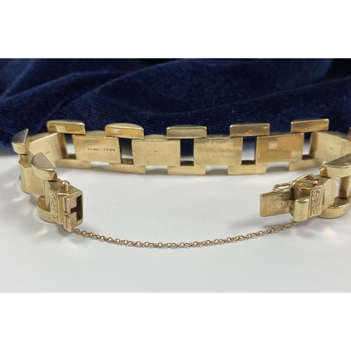 49 - A HEAVY GEORGE VI 9CT GOLD LINK BRACELET, open triple link bracelet with engraved panels to central ... 