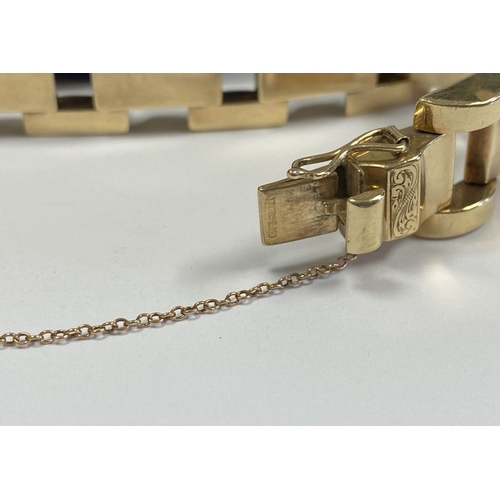 49 - A HEAVY GEORGE VI 9CT GOLD LINK BRACELET, open triple link bracelet with engraved panels to central ... 