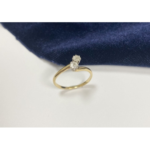 52 - A BEAUTIFUL 14CT YELLOW GOLD TWO STONE DIAMOND RING, two round cut diamonds claw set in raised prong... 