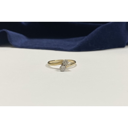 52 - A BEAUTIFUL 14CT YELLOW GOLD TWO STONE DIAMOND RING, two round cut diamonds claw set in raised prong... 