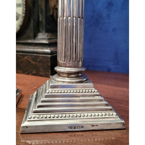 6 - A FINE PAIR OF SILVER CORINTHIAN COLUMN CANDLESTICKS, elegant pair with square graduated step base w... 