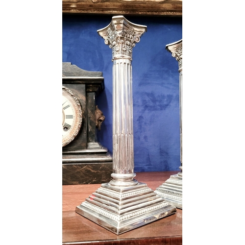 6 - A FINE PAIR OF SILVER CORINTHIAN COLUMN CANDLESTICKS, elegant pair with square graduated step base w... 