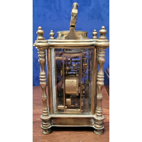 64 - AN EARLY 20TH CENTURY BRASS FRAMED REPEATING CARRIAGE CLOCK, with white enamelled dial, with Roman n... 