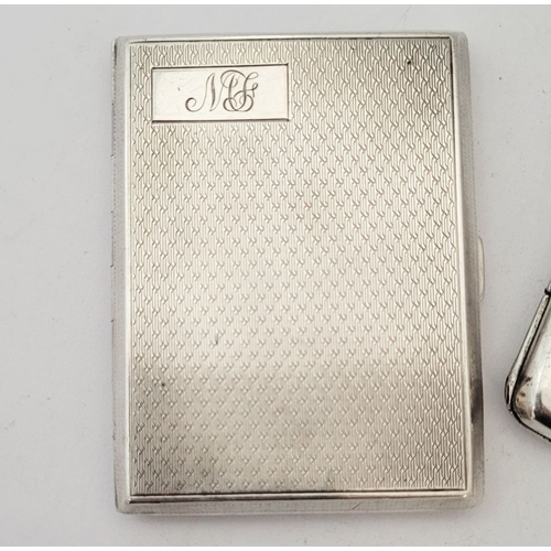 75 - THREE SILVER CIGARETTE CASES, (i) A neatly sized case decorated with engine cut design to the front,... 