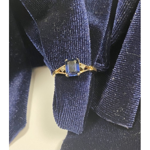 80 - A PRETTY 9CT GOLD PLATED SAPPHIRE RING, large emerald cut sapphire in claw setting, flanked by marca... 